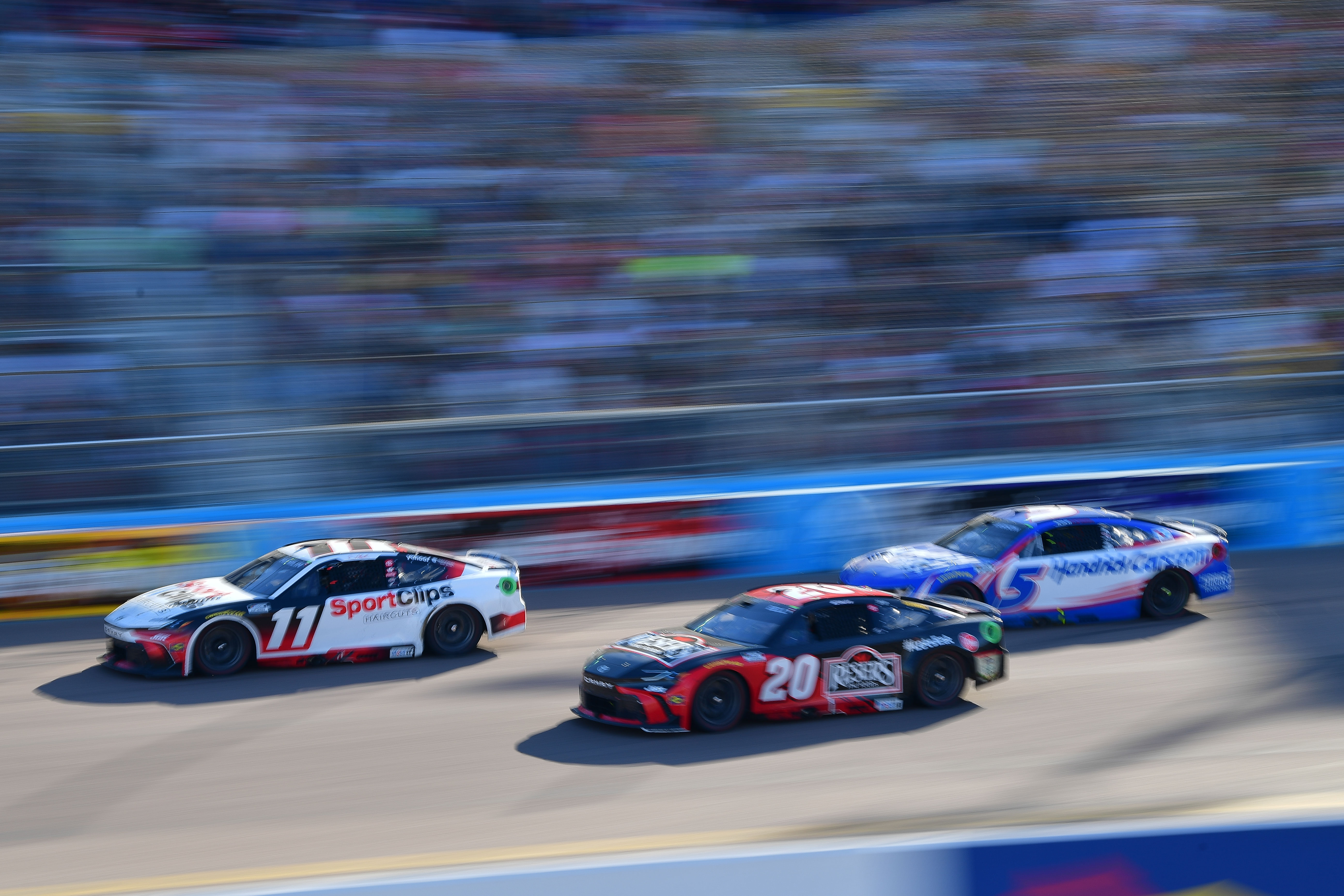Denny Hamlin (11) leads Christopher Bell (20) and Kyle Larson (5) during the Shriners Children's 500. Source: Imagn